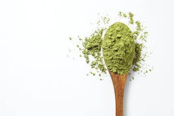 Matcha green tea powder in a wooden spoon on white background