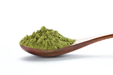 Matcha green tea powder in a wooden spoon