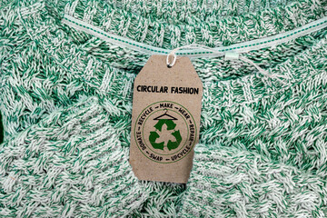 Circular Fashion label on jumper, , make, wear, repair, upcycle, swap, donate, recycle with eco...