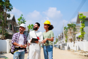 Arab man and team working. Professional woman and man. African American mixed-race people. Construction worker and business owner working on digital tablet computer in construction site