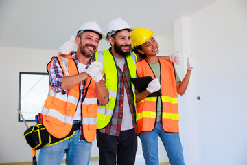 Professional Mechanical Engineer and construction team at house project underconstruction site. Hands meeting together in line. Unity and teamwork concept.