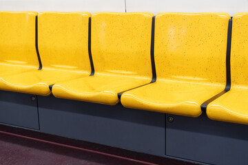 Bright yellow seats on the train