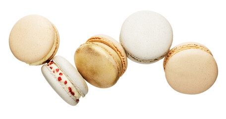 Isolated on white background white, yellow, gold macaron cookies flying, falling in motion or levitating. Colorful, sweet small French macaroon cakes. Five full cookies isolate. High quality photo