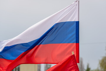 Red flags of Russia at the demonstration. Tricolor.