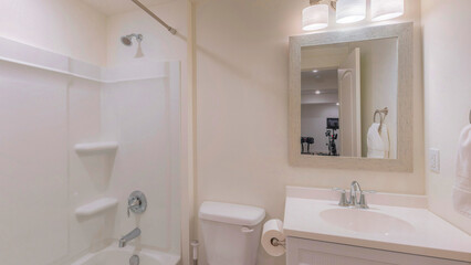 Panorama Interior of a bathroom with white and light beige colors