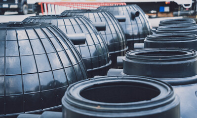 black plastic water storage tanks at the manufacturer factory depot