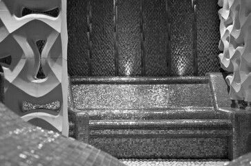 Turkish bath or steam sauna with mosaic tiles inside male locker room of spa or wellness are...
