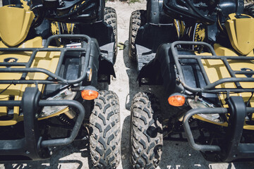 Obraz premium View of row dirty ATVs quad bike