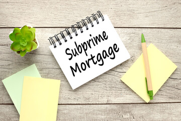 Naklejka premium subprime management, text in an open notepad. near yellow and green sticker business concept