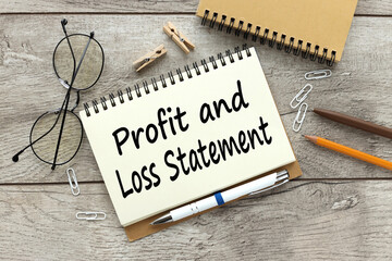 profit and loss statement. text on open notepad near glasses - obrazy, fototapety, plakaty