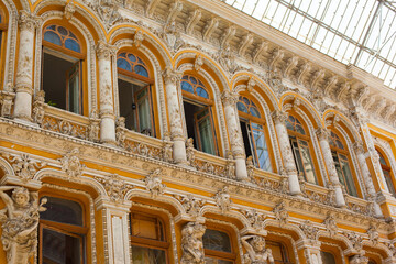 Beautiful modern architecture in Odessa passage, the historical building and the first shopping mall in the city. Glass roof top, baroque decorated walls and bas-reliefs