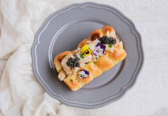 Delicious healthy homemade pastry meal. Shrimp Roll Black Caviar Gold Leaf with Edible Flowers.