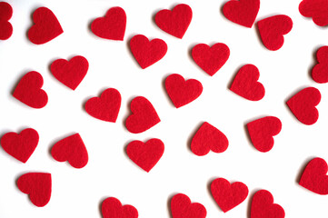 Red felt hearts on the white background
