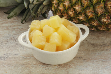 Marinated pineapple slices in the bowl