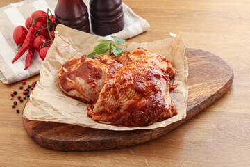 Marinated chicken leg in tomato sauce