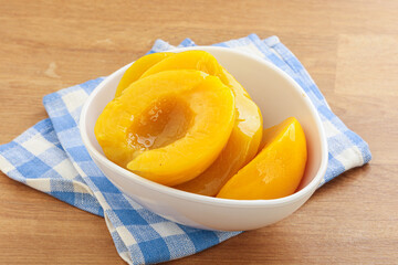 Sweet canned peaches with syrope