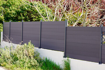 high grey fence modern barrier aluminum slats suburb house protection view home - Powered by Adobe
