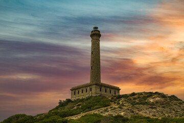 Cabo de Palos lighthouse at sunset, in Cartagena.