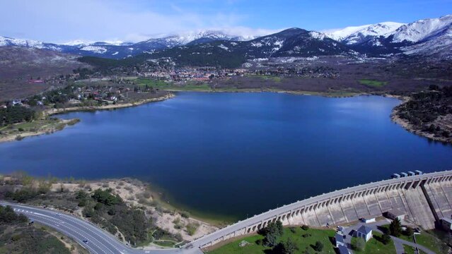 Incredible high angle aerial view over the Reservoir and Dam of Navacerrada in Spain.
