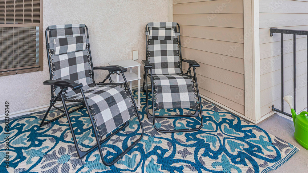 Wall mural panorama porch of a house with two lounge chairs and carpet with blue and white colors