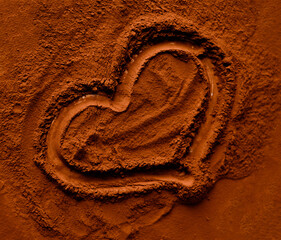 Cocoa is poured on the table with a heart painted on it