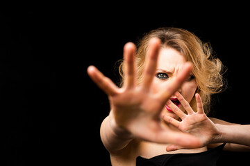 Stop hand. Emotional angry woman, upset girl. Screaming, hate, rage. Pensive woman feeling furious mad and crazy stress.