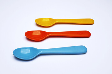 Three plastic spoons, non-organic product ... 
