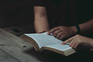 Men and women are studying the same Bible. bible background	
