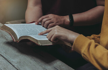 Men and women are studying the same Bible. bible background	
