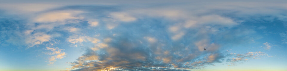 Dark blue sunset sky panorama with Cumulus clouds. Seamless hdr pano in spherical equirectangular format. Complete zenith for 3D visualization, game and sky replacement for aerial drone 360 panoramas.