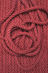 Red hemp rope tangled on stripes, background concept ...