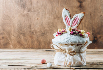 Easter Panettone with bunny ears cookies, mini chocolate eggs, marshmallows and dry roses.