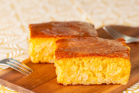 Closeup Of Italian Rice Pudding Cake Made With Almonds, Milk And Amaretti Cookies., Called Also Torta Degli Addobbi Or Torta Di Riso. Yellow Background.