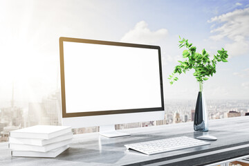 Close up of modern designer desktop with books, clean white computer screen, decorative plant, supplies and bright city and sky view background. Mock up, 3D Rendering.
