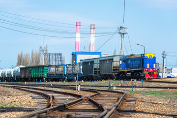 Fototapeta na wymiar Freight train on the territory of the plant, industrial zone.