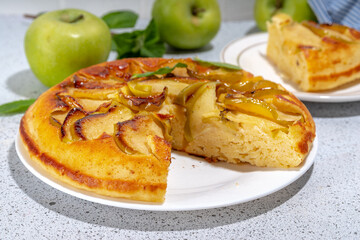Classic upside-down apple cake. Retro apple cake recipe, cooked in frying pan easy autumn summer homemade baking sweet pastry, with fresh green apples copy space