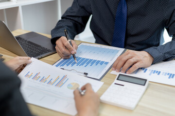 Brainstorm team, Marketers and financial accountants are discussing and analyzing charts to plan a company's growth and development strategy, Team meetings or business consulting, Business profit.