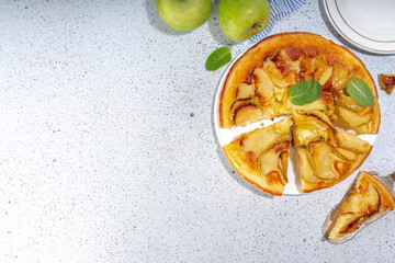Classic upside-down apple cake. Retro apple cake recipe, cooked in frying pan easy autumn summer homemade baking sweet pastry, with fresh green apples copy space