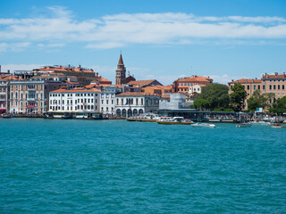 The grand canal in venice with car ferry in italy with cityscape view.