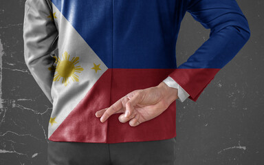 Businessman Jacket with Flag of Philippines with his fingers crossed behind his back