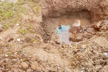 plumbing broken plastic pipe in the hole and water in wait repair