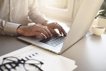 Man hands typing on computer keyboard closeup, businessman or student using laptop at home, online learning, internet marketing, working from home, office workplace, freelance concept