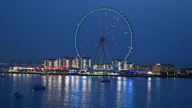 4K: Ain Dubai, the world's biggest and tallest Ferris wheel during blue hours, View of Bluewaters Island in Dubai.