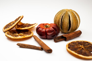 Fototapeta premium Dried fruit, fruit and cinnamon on white background