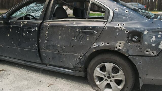 Shot car in Irpin, the consequences of the invasion of Russian troops in Ukraine