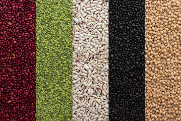 Different types of legumes, chickpeas and green peas, red, white and black beans, top view