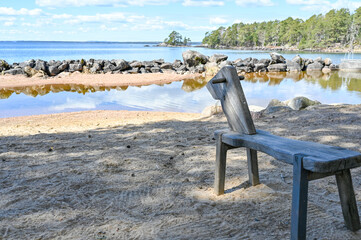 sandy beach with home made wooden child toy