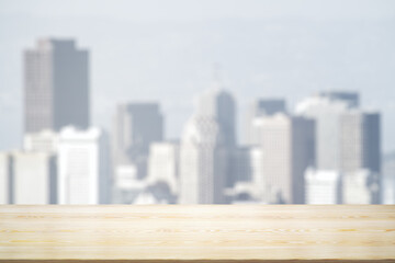 Blank wooden tabletop with beautiful blurry skyline in sunny weather on background, mockup