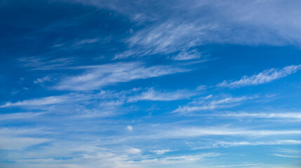 Naklejka na ściany i meble Dramatic blue sky with white clouds.