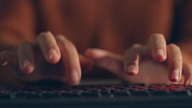 Timelapse woman&rsquo;s hand typing on keyboard at night, overtime